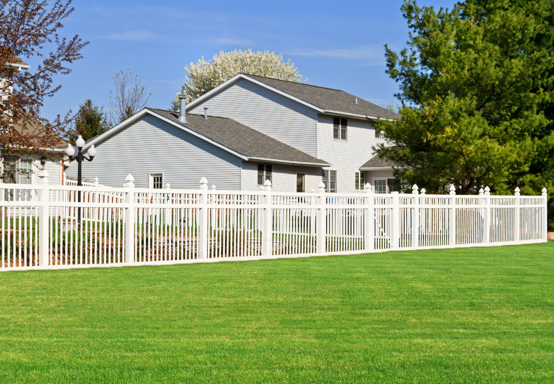 fence installation White PVC privacy fence with custom access gate installed by Pick-It Fence Company in Palm Beach Island, Florida.