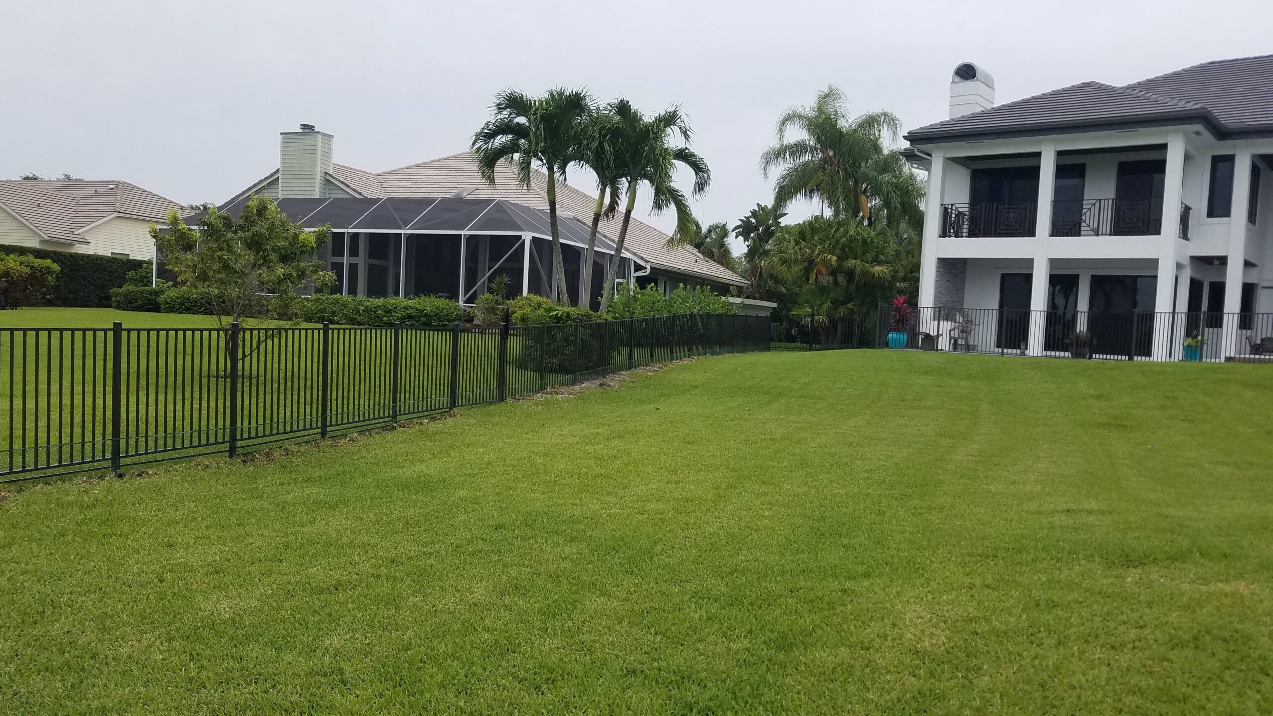 Black aluminum fence installation for residential property by Pick-It Fence Company, Palm Beach County FL